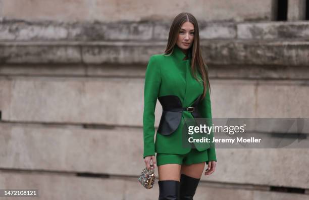 Lorena Rae wears black overknee high heels, a glitter mini bag, a green blazer, a black leather corset and green shorts, outside Elie Saab show,...