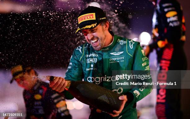 Third placed Fernando Alonso of Spain and Aston Martin F1 Team celebrates on the podium during the F1 Grand Prix of Bahrain at Bahrain International...