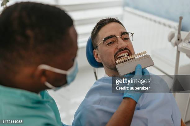 whitening teeth - dental implant stock pictures, royalty-free photos & images