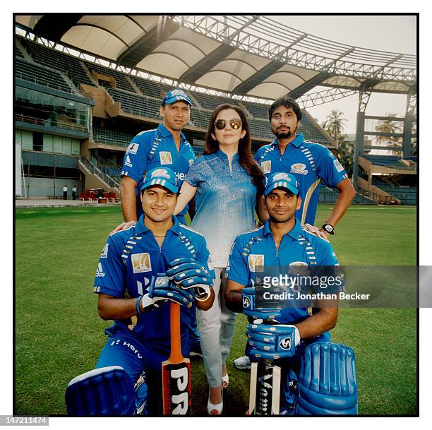 Business woman and founder/chairperson of Dhirubhai Ambani International School, Nita Ambani is photographed with players from the Mumbai Indians, a...
