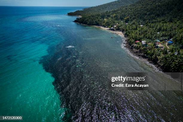 An aerial view shows oil slick from the sunken tanker MT Princess Empress along a shoreline on March 08, 2023 in Pola, Oriental Mindoro, Philippines....