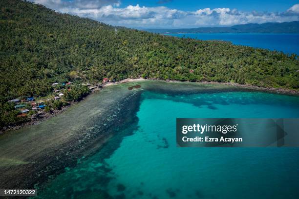 An aerial view shows oil slick from the sunken tanker MT Princess Empress along a shoreline on March 08, 2023 in Pola, Oriental Mindoro, Philippines....