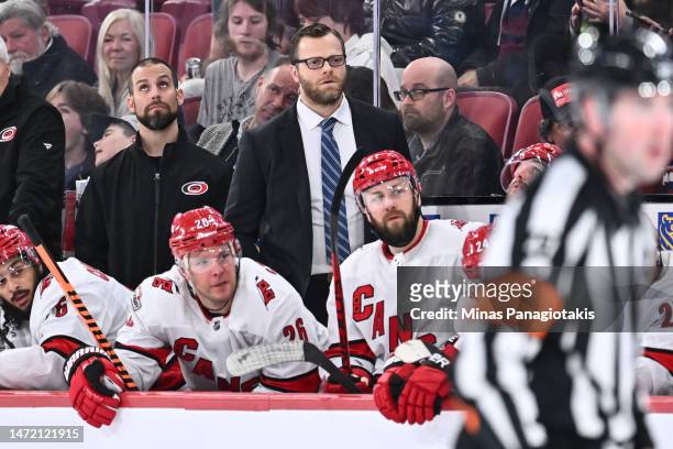 Assistant coach of the Carolina Hurricanes Tim Gleason works the bench during the first period against the Montreal Canadiens at Centre Bell on March...