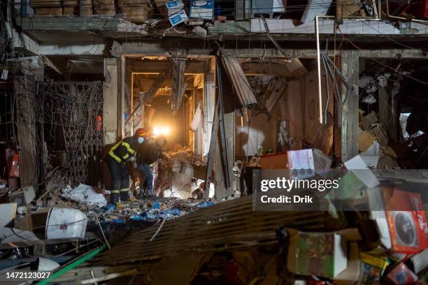 Firefighters and emergency teams work amid debris after an explosion inside Siddique Bazar in Old Dhaka on March 7, 2023 in Dhaka, Bangladesh. An...