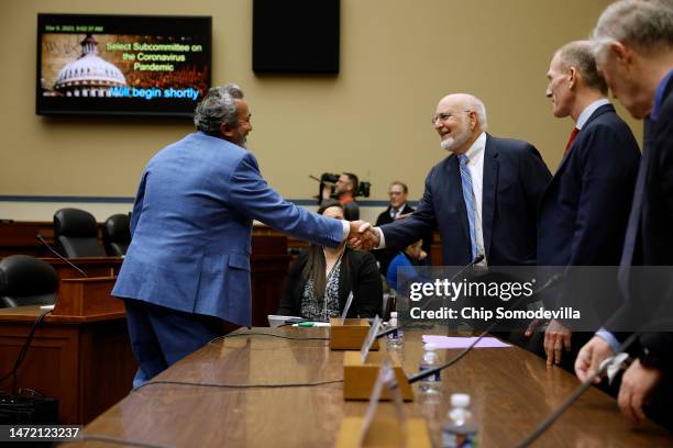 Rep. Ami Bera greets Dr. Robert Redfield, former director of the U.S. Centers for Disease Control and Prevention under former President Donald Trump,...