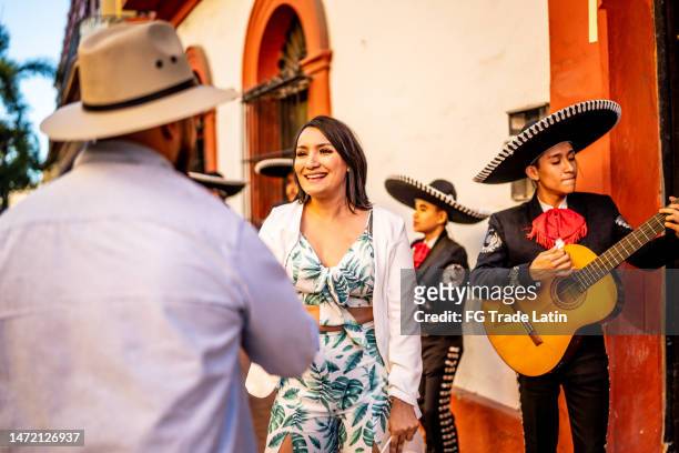 couple dancing mariachi music at the historic district - mexican tradition stock pictures, royalty-free photos & images