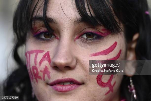 Girl attends the protest during the International Women's Day on March 8, 2023 in Turin, Italy. International Women's Day has been commemorated...