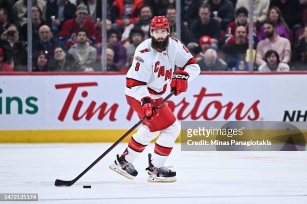 Brent Burns of the Carolina Hurricanes skates the puck during the third period against the Montreal Canadiens at Centre Bell on March 7, 2023 in...