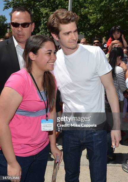 Actor Andrew Garfield poses for pictures with a fan after he delivered a Chilean Rose Tarantula to the American Museum of Natural History on June 27,...