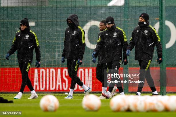 Manchester United enter the pitch to warm up during a training session ahead of their UEFA Europa League round of 16 leg one match against Real Betis...