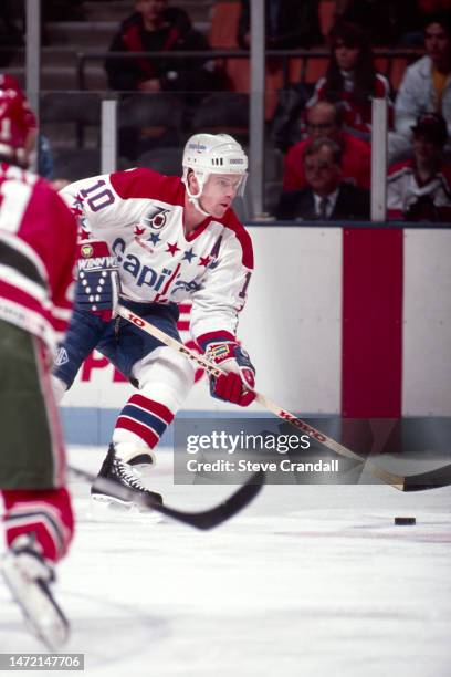 Washington Capitals forward, Kelly Miller, carries the puck into the Devil's zone during the game against the NJ Devils at the Meadowlands Arena on...