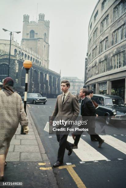 British Royal Charles, Prince of Wales, wearing a tweed jacket, a student at Trinity College, Cambridge University, walking in Cambridge,...