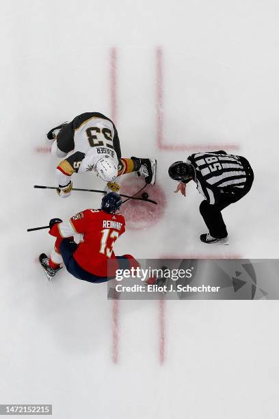 Linesmen Ryan Gibbons drops the puck for a face off between Teddy Blueger of the Vegas Golden Knights and Sam Reinhart of the Florida Panthers at the...