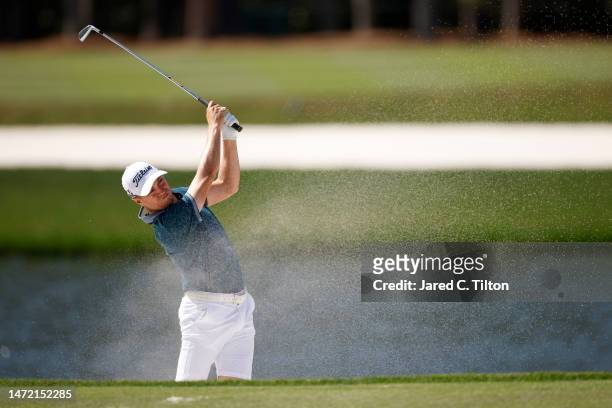 Justin Thomas of the United States plays a shot from a bunker on the seventh hole during a practice round prior to THE PLAYERS Championship on THE...