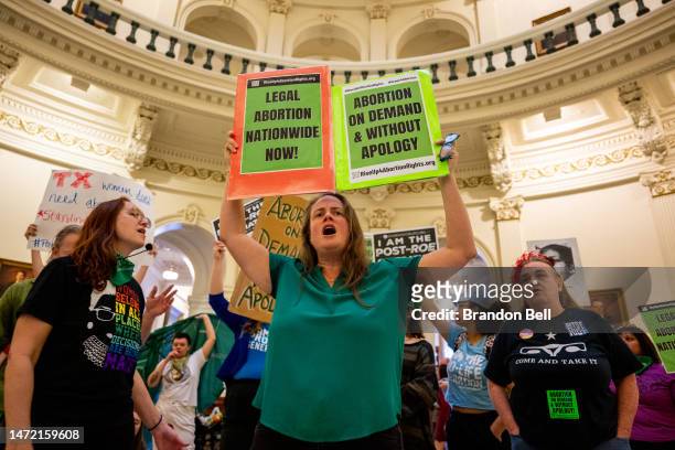 Abortion rights activist Rachel Bailey chants during an International Women's Day abortion rights demonstration at the Texas State Capitol on March...