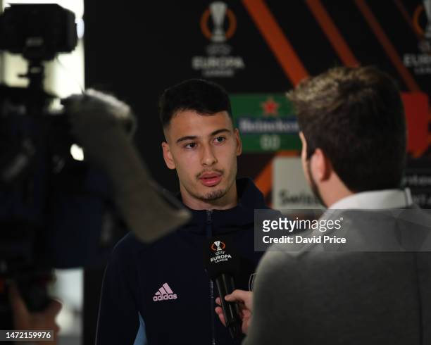 Gabriel Martinelli of Arsenal speaks to the press ahead of their UEFA Europa League round of 16 leg one match against Sporting CP at Estádio José...