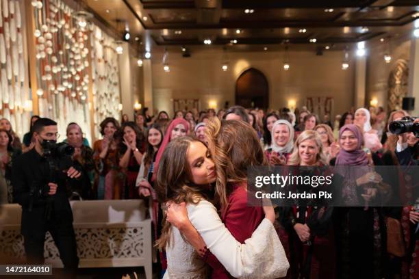 In this handout photo issued by The Royal Hashemite Court, Her Majesty Queen Rania and Her Royal Highness Princess Iman attend the Henna party Her...