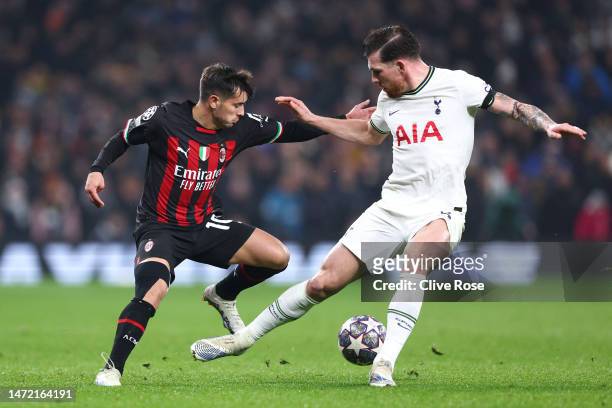 Brahim Diaz of AC Milan is challenged by Pierre-Emile Hojbjerg of Tottenham Hotspur during the UEFA Champions League round of 16 leg two match...