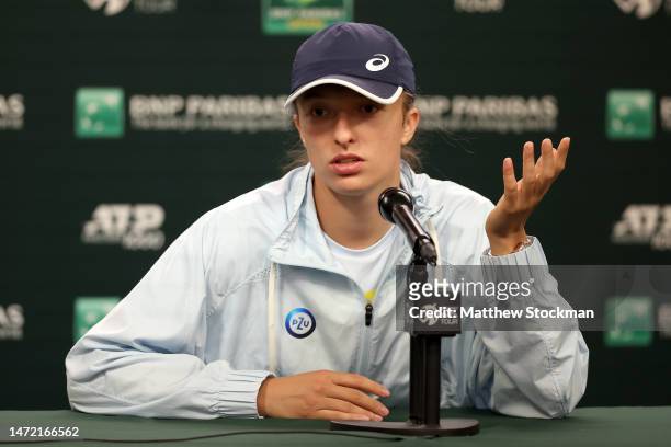 Iga Swiatek of Poland fields questions from the media during the BNP Paribas Open at the Indian Wells Tennis Garden on March 08, 2023 in Indian...