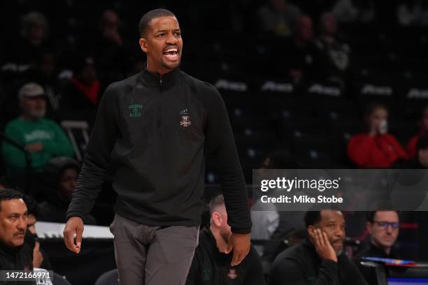 Head coach Kim English of the George Mason Patriots yells out from the bench against the Richmond Spiders in the first half during the Second Round...