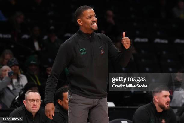 Head coach Kim English of the George Mason Patriots yells out from the bench against the Richmond Spiders in the first half during the Second Round...