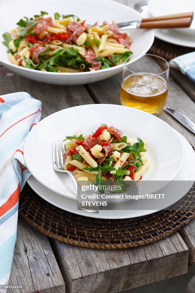 Plate of vegetable pasta on table