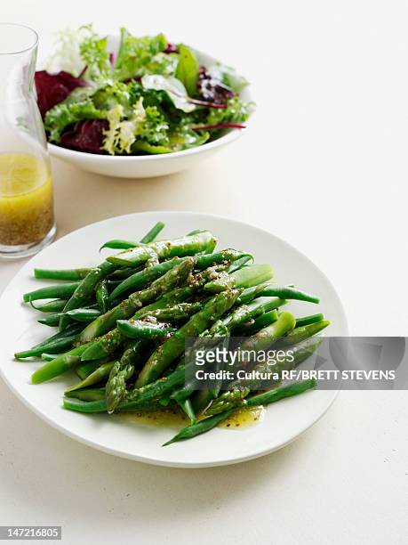 plate of roasted asparagus - green beans stock pictures, royalty-free photos & images