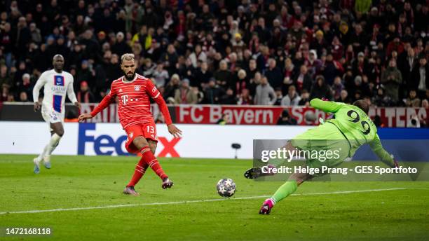 Eric Maxim Choupo-Moting of Munich scores his team's first goal against Gianluigi Donnarumma of Paris during the UEFA Champions League round of 16...