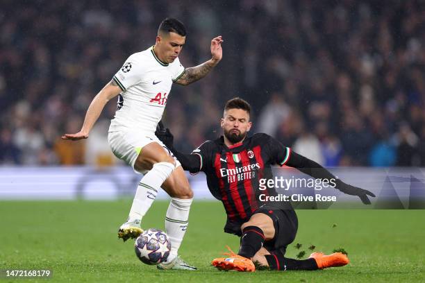 Pedro Porro of Tottenham Hotspur is tackled by Olivier Giroud of AC Milan during the UEFA Champions League round of 16 leg two match between...