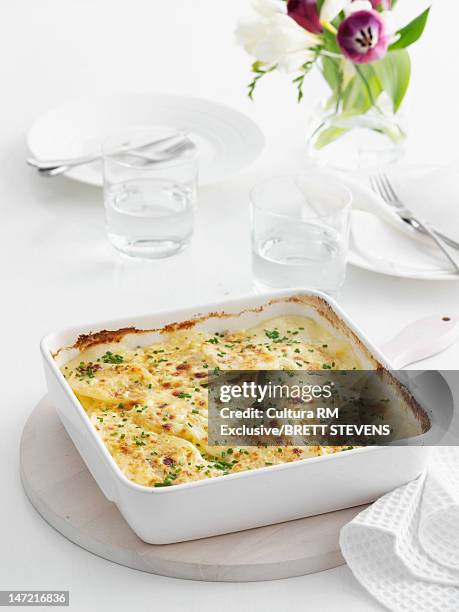 baked casserole dish on table - casserole stock pictures, royalty-free photos & images