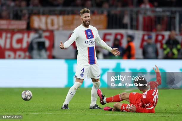 Sergio Ramos of Paris Saint-Germain pushes Thomas Mueller of FC Bayern Munich during the UEFA Champions League round of 16 leg two match between FC...