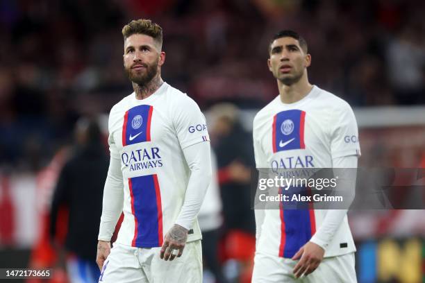 Sergio Ramos and Achraf Hakimi of Paris Saint-Germain look dejected after the team's defeat in the UEFA Champions League round of 16 leg two match...