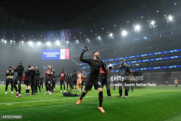 General view as Olivier Giroud of AC Milan throws their shirt into the crowd as they celebrate victory after the UEFA Champions League round of 16...