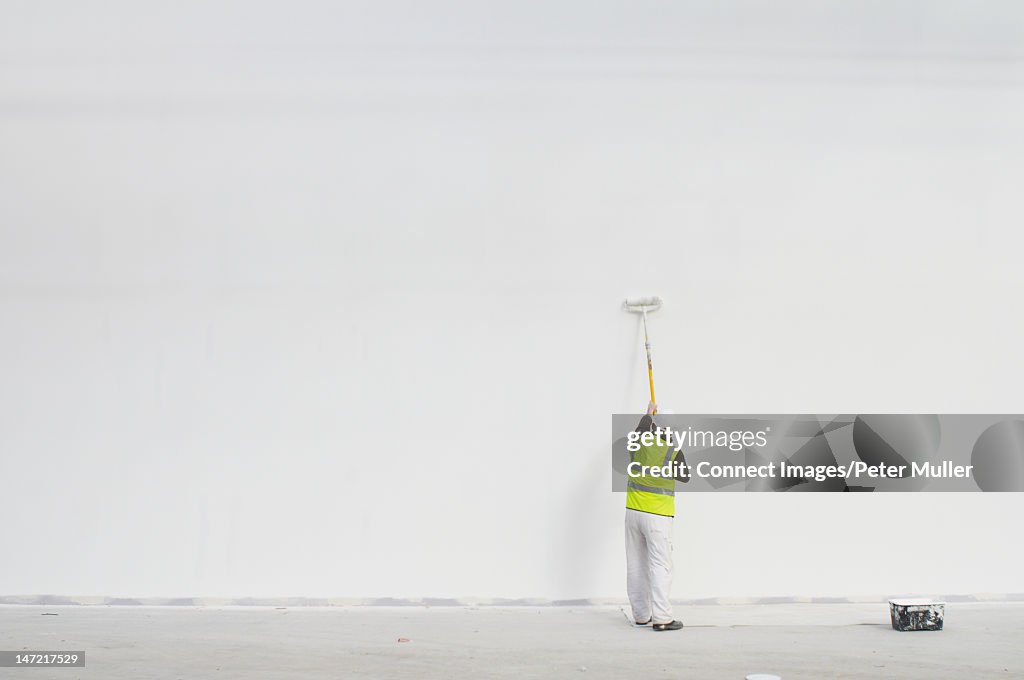 Worker painting on site