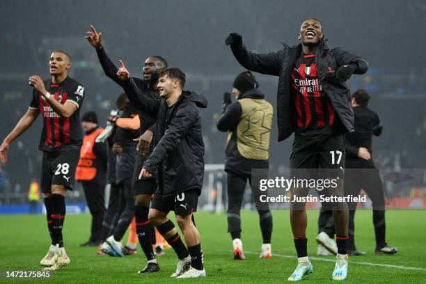 Rafael Leao of AC Milan celebrates victory with teammates after the UEFA Champions League round of 16 leg two match between Tottenham Hotspur and AC...