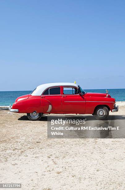 vintage car on beach - red white and blue beach stock pictures, royalty-free photos & images