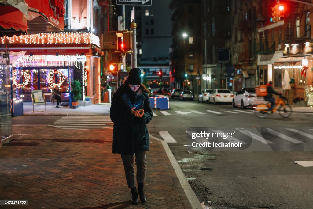 Checking apps on the go in the evening walk