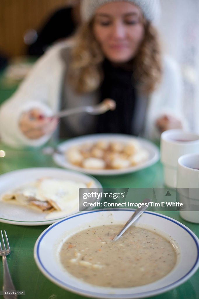 Close up of plate of soup at table