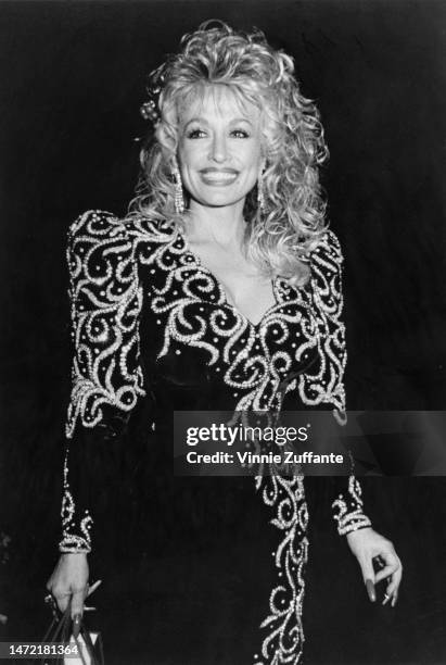 Dolly Parton attends Sandy Gallin's Holiday Party at the Home of Sandy Gallin in Beverly Hills, California, United States, 18th December 1988.