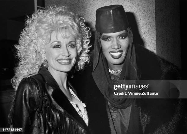 Dolly Parton and Grace Jones meets the press at The Gotham in Harlem. She was honoured by her new record company, CBS, Harlem, New York, United...