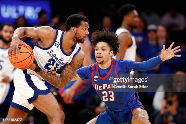 Femi Odukale of the Seton Hall Pirates dribbles against Caleb Murphy of the DePaul Blue Demons during the first half in the first round of the Big...