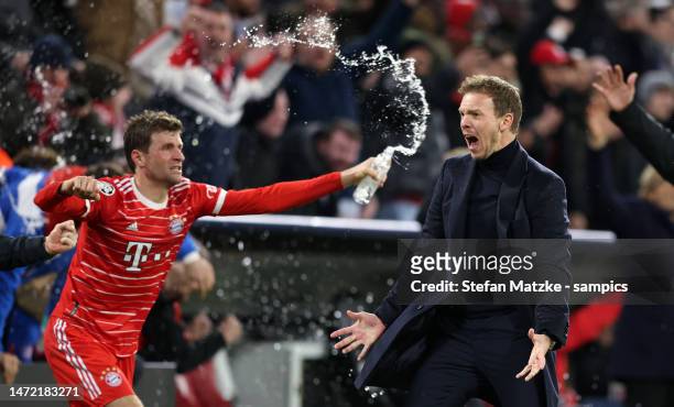 Coach Julian Nagelsmann of Bayern Muenchen celebrates with Thomas Mueller of Bayern Muenchen as Serge Gnabry of Bayern Muenchen scores the second...