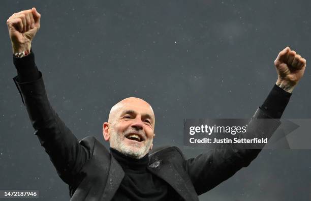 Stefano Pioli, Head Coach of AC Milan celebrates victory in front of their fans after the UEFA Champions League round of 16 leg two match between...