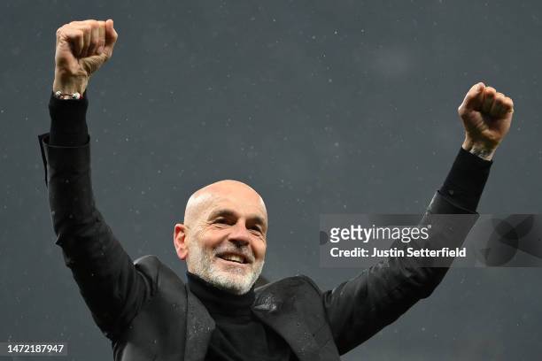 Stefano Pioli, Head Coach of AC Milan celebrates victory in front of their fans after the UEFA Champions League round of 16 leg two match between...