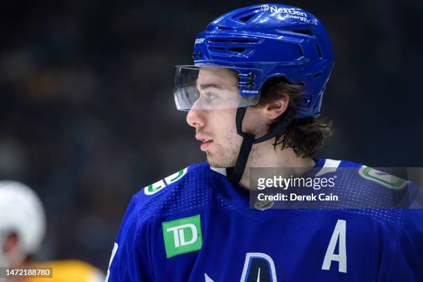 Quinn Hughes of the Vancouver Canucks waits for a face-off during the second period of their NHL game against the Nashville Predators at Rogers Arena...