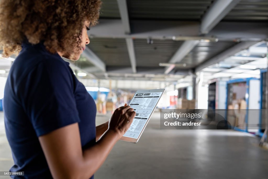 Supervisor working at a commercial dock and organizing the shipments