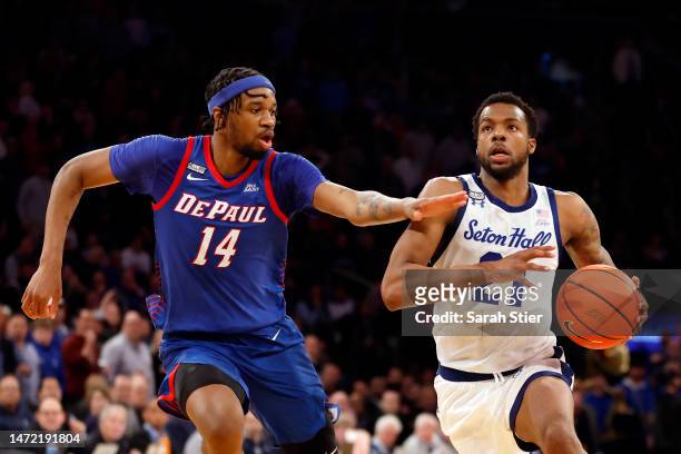 Femi Odukale of the Seton Hall Pirates dribbles as Nick Ongenda of the DePaul Blue Demons defends during the second half in the first round of the...