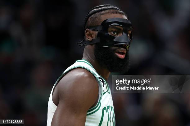 Jaylen Brown of the Boston Celtics looks on with a protective face mask during the first half against the Portland Trail Blazers at TD Garden on...