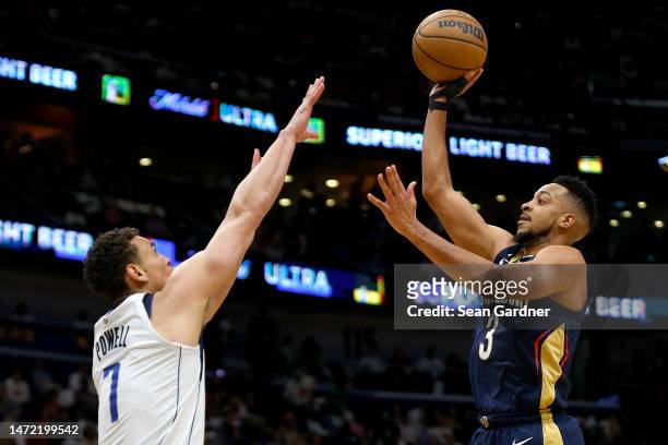 McCollum of the New Orleans Pelicans shoots over Dwight Powell of the Dallas Mavericks during the second quarter of an NBA game at Smoothie King...