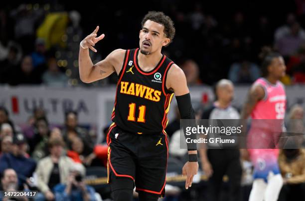 Trae Young of the Atlanta Hawks celebrates after scoring in the fourth quarter against the Washington Wizards at Capital One Arena on March 08, 2023...